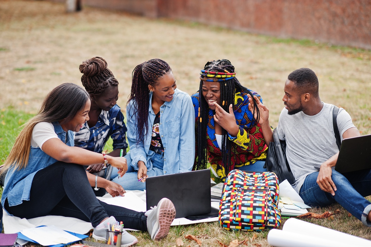 group of five african college students spending time together on